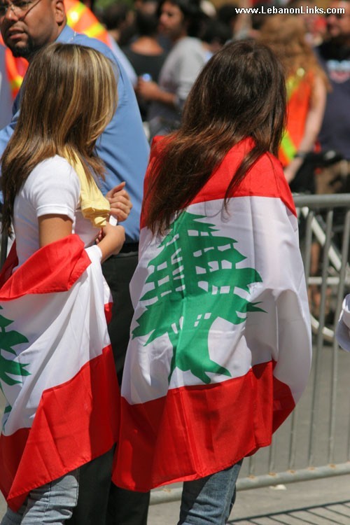 Two Women wearing Flag