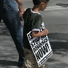 Little Boy Carry Sign