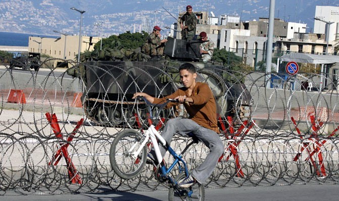 Boy on a Bike during the Opposition Protests