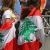 Two Women wearing Flag